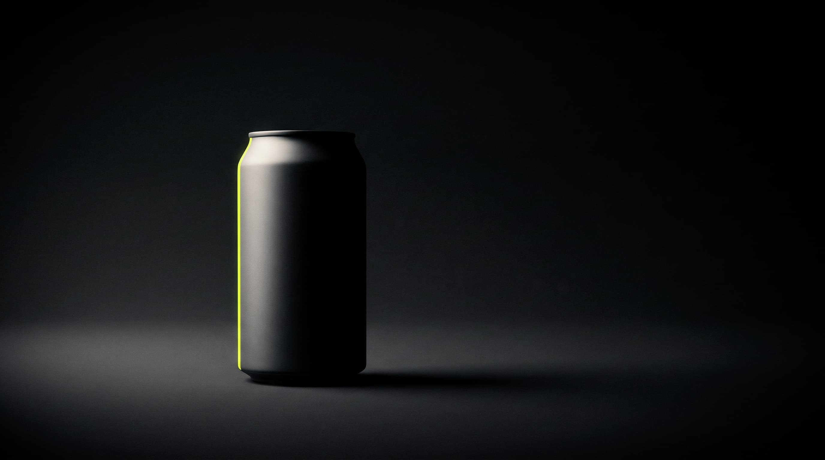 A matte black drinks can alone in darkness, one lime line of light down its left edge